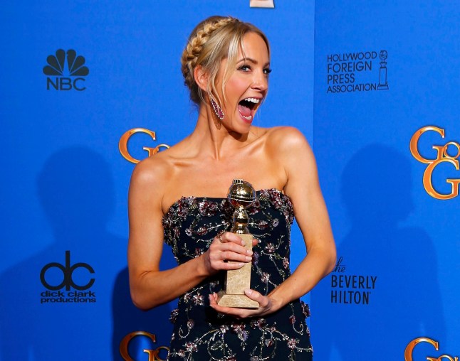 Joanne Froggatt poses with her award for Best Supporting Actress in a Series, Mini-Series or TV Movie for her role in "Downton Abbey" backstage at the 72nd Golden Globe Awards in Beverly Hills, California January 11, 2015. REUTERS/Mike Blake (UNITED STATES - Tags: ENTERTAINMENT TPX IMAGES OF THE DAY) (GOLDENGLOBES-BACKSTAGE)
