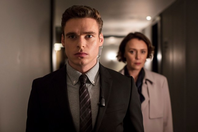 This image released by Netflix shows Richard Madden, left, and Keeley Hawes in a scene from "Bodyguard." On Tuesday, July 16, 2019, the program was nominated for an Emmy Award for outstanding drama series. (Sophie Mutevelian/Netflix via AP)