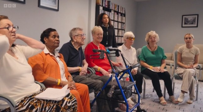Rose Ayling-Ellis: Old Hands, New Tricks Series 1: Episode 1 Rose Ayling-Ellis arrives at Hughenden Gardens Retirement Village on a bold and heartfelt mission ? to teach British Sign Language (BSL) to a group of retirees in just six weeks. Her goal is to explore whether BSL can enhance their quality of life, deepen connections and combat the isolation that often comes with hearing loss. The students ? some well into their nineties ? embrace the challenge with enthusiasm, despite the hurdles of learning a new language at a later stage of life. To support their journey, Rose enlists the help of her friend, charismatic teacher Marios Costi. As the lessons progress, the group begin to share their life stories in an entirely new way. For 92-year-old Eric, the experience extends beyond the classroom as he starts teaching his great-grandchildren some signs. His daughter observes that the classes are ?taking ten years off him?. Meanwhile, Sue, who is losing her sight, expresses frustration with the word 'disabled', struggling with being seen as different. Rose hopes to shift perspectives, so she takes the group to one of her favourite places ? the Jewish Deaf Association in London. Here, the residents witness a vibrant, thriving deaf community that challenges their preconceptions. Sue has a powerful breakthrough when she meets Michael, a deafblind man whose radiant positivity changes her outlook on life.