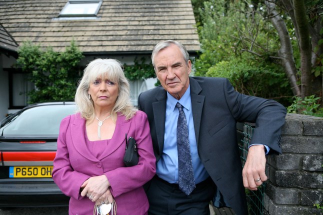 Pam (ALision Steadman) and Mick (Larry Lamb) from Gavin and Stacey stand oiutside their home in formalware