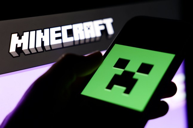 Mandatory Credit: Photo by Jakub Porzycki/NurPhoto/Shutterstock (15231943f) Minecraft website displayed on a laptop screen and Minecraft logo displayed on a phone screen are seen in this illustration photo taken in Krakow, Poland on March 31, 2025. Minecraft Photo Illustrations, Krakow, Poland - 31 Mar 2025