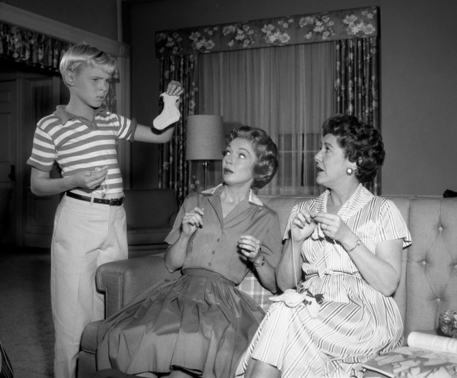 LOS ANGELES - MARCH 10: Dennis The Menace, a CBS television situation comedy. Episode, Baby Booties, originally broadcast March 10, 1963. Pictured from left is Jay North (as Dennis Mitchell), Gloria Henry (as Alice Mitchell), Sara Seegar (as Eloise Wilson). (Photo by CBS via Getty Images)