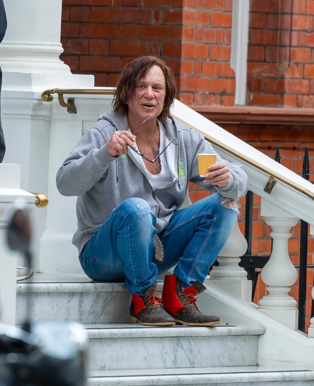 13 April 2025 - EXCLUSIVE. EXCLUSIVE: Mickey Rourke Resurfaces After Celebrity Big Brother Axe ??? and He Looks Like He's Gone Ten Rounds with Tyson! Hollywood hellraiser Mickey Rourke has finally emerged after his shock exit from the Celebrity Big Brother house ??? and fans could hardly believe their eyes. The Sin City star, 72, cut a disheveled figure as he was spotted loitering outside a plush hotel, clutching a takeaway coffee while flanked by a burly close protection guard. Wearing dark shades and a weathered expression, Rourke looked every inch the battle-worn boxer ??? ironic, given his real-life history in the ring. Sources close to the star say he's been laying low since his dramatic eviction Credit: CLICK NEWS AND MEDIA Ref: AMdef **Exclusive to CLICK NEWS AND MEDIA** CLICK NEWS AND MEDIA - PICTURES@CLICKNEWSANDMEDIA.COM - 07774 321240 -