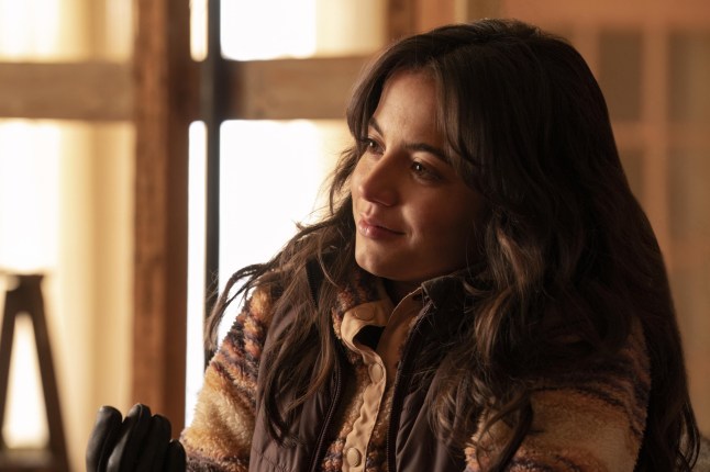 Isabela Merced in The Last of Us as Dina, smiling.