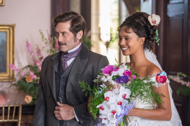 John Arnold and Alisha Boe in The Buccaneers dressed in wedding attire