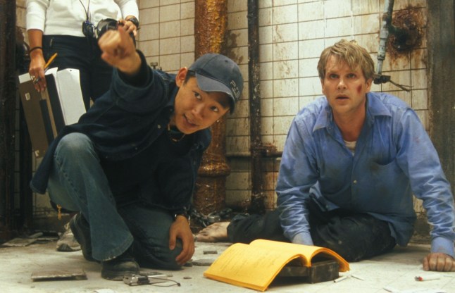 Editorial use only. No book cover usage. Mandatory Credit: Photo by Evolution/Saw Prods Inc/Kobal/Shutterstock (5878364b) James Wan, Cary Elwes Saw - 2004 Director: James Wan Evolution Entertainment/Saw Prods. Inc USA On/Off Set