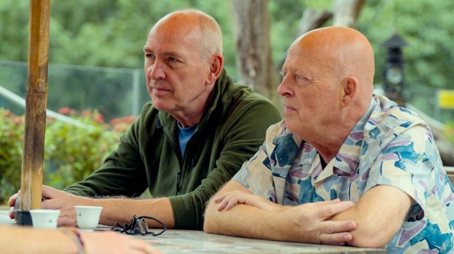 Brian and Melvyn on Race Across The World. The brothers are sitting at a table next to each other