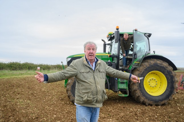 Jeremy Clarkson with his tractor in a field