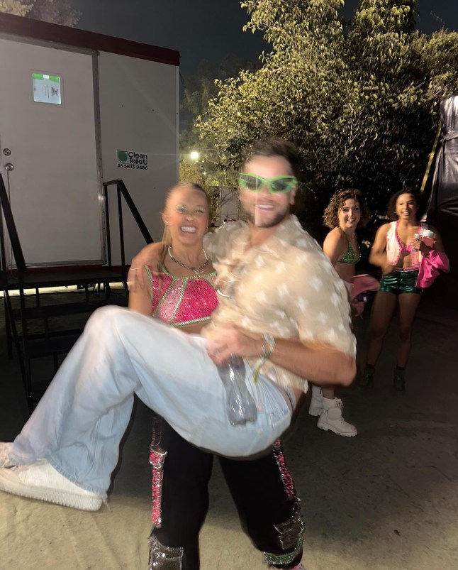 JoJo Siwa lies on top of Chris Hughes after 'finally reuniting' on holiday
