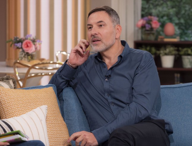 David Walliams in a blue shirt sat down on the sofa on This Morning
