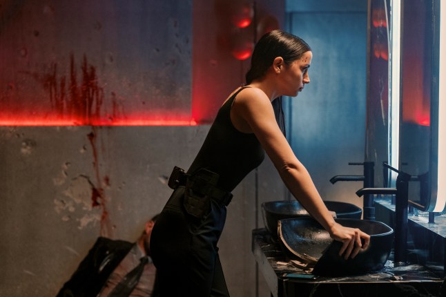 Ana de Armas as Eve standing by a sink in Ballerina