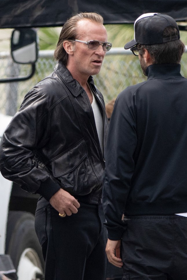 EXCLUSIVE: Christian Bale looks unrecognizable in a leather jacket, slicked back hair and sporting three dazzling Super Bowl rings on the set of ?Madden? in Atlanta. The 51-year-old Oscar winner cut a totally unfamiliar figure as he filmed the hotly-anticipated David O. Russell flick alongside Nicolas Cage on Wednesday. In costume, Bale bears a striking resemblance to his real life character - the late Al Davis, the Oakland Raiders team owner and manager - and sported a somewhat ruddy complexion, especially visible in close up shots without his eyeglasses. Cage, who was also spotted in a fatsuit and long hair, plays Raiders head coach?turned-iconic broadcaster?John Madden. Comedian John Mulaney?stars as Trip Hawkins,?and British actress Sienna Miller?as Al?s wife Carol Davis. 04 Jun 2025 Pictured: Christian Bale. Photo credit: Christopher Oquendo / MEGA TheMegaAgency.com sales@mega.global