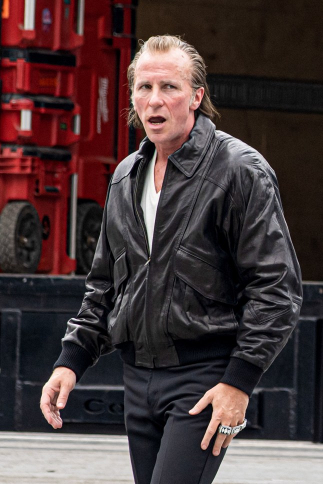 EXCLUSIVE: Christian Bale looks unrecognizable in a leather jacket, slicked back hair and sporting three dazzling Super Bowl rings on the set of ?Madden? in Atlanta. The 51-year-old Oscar winner cut a totally unfamiliar figure as he filmed the hotly-anticipated David O. Russell flick alongside Nicolas Cage on Wednesday. In costume, Bale bears a striking resemblance to his real life character - the late Al Davis, the Oakland Raiders team owner and manager - and sported a somewhat ruddy complexion, especially visible in close up shots without his eyeglasses. Cage, who was also spotted in a fatsuit and long hair, plays Raiders head coach?turned-iconic broadcaster?John Madden. Comedian John Mulaney?stars as Trip Hawkins,?and British actress Sienna Miller?as Al?s wife Carol Davis. 04 Jun 2025 Pictured: Christian Bale. Photo credit: Christopher Oquendo / MEGA TheMegaAgency.com sales@mega.global (Mega Agency TagID: MEGA1320592_004.jpg) [Photo via Mega Agency]