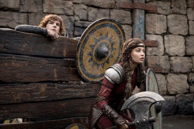 This image released by Universal Pictures shows Mason Thames, left, and Nico Parker in a scene from "How to Train Your Dragon.", (Universal Pictures via AP)
