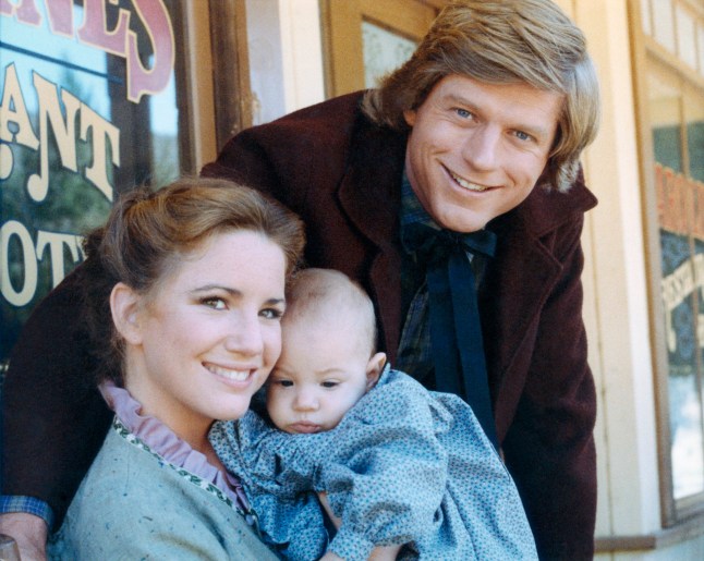 LITTLE HOUSE ON THE PRAIRIE -- Season 8 -- Pictured: (l-r) Melissa Gilbert as Laura Elizabeth Ingalls Wilder, Michelle Steffin as Rose Wilder, Dean Butler as Almanzo James Wilder (Photo by NBCU Photo Bank/NBCUniversal via Getty Images via Getty Images)