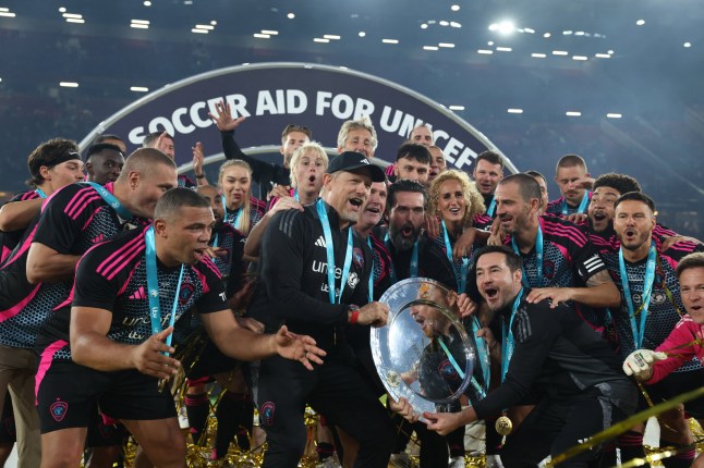 World XI players celebrate their victory in the England XI v World XI charity football match for Soccer Aid for Unicef at Old Trafford in Manchester, north-west England on June 15, 2025. World XI won the game 5-4. (Photo by Darren Staples / AFP) (Photo by DARREN STAPLES/AFP via Getty Images)